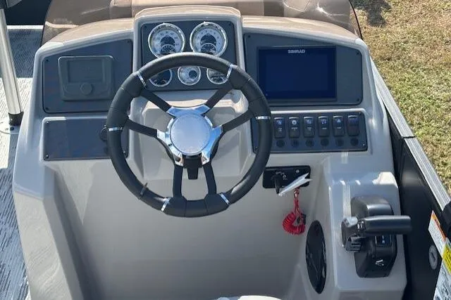 Slide: The Image of 2026 Starcraft EXS 3 Q DH boat dashboard with steering wheel and control panel. - 10