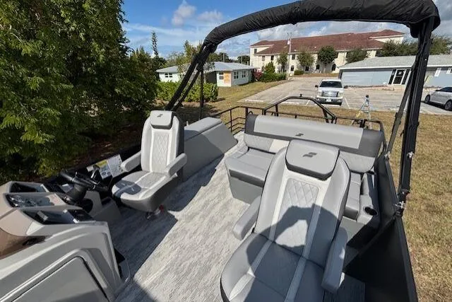 Slide: The Image of 2026 Starcraft EXS 3 Q DH boat interior with modern seating and controls. - 9