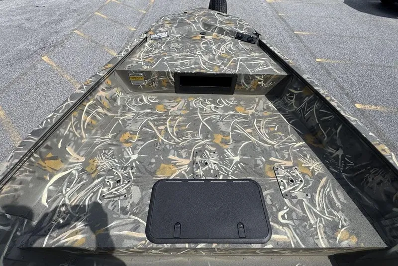 Slide: The Image of 2026 War Eagle 961 Blackhawk boat with camouflage interior design. - 12