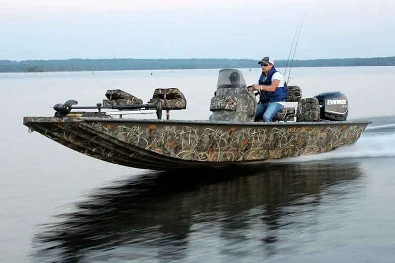 Slide: The Image of 2026 War Eagle 961 Blackhawk boat speeding on a lake with camouflage design. - 18