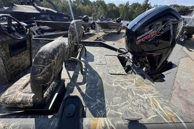 Slide: The Image of 2026 War Eagle 961 Blackhawk boat with camo seats and Mercury Pro XS engine. - 19