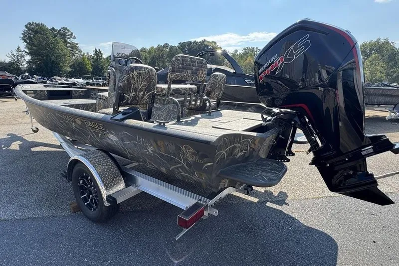 Slide: The Image of 2026 War Eagle 961 Blackhawk boat with camo seats and Mercury Pro XS engine. - 4