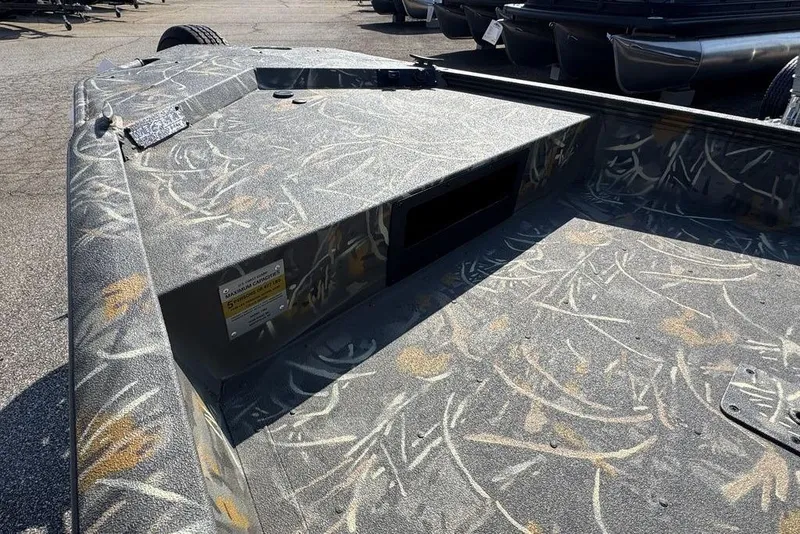 Slide: The Image of 2026 War Eagle 961 Blackhawk boat with camouflage interior design. - 9