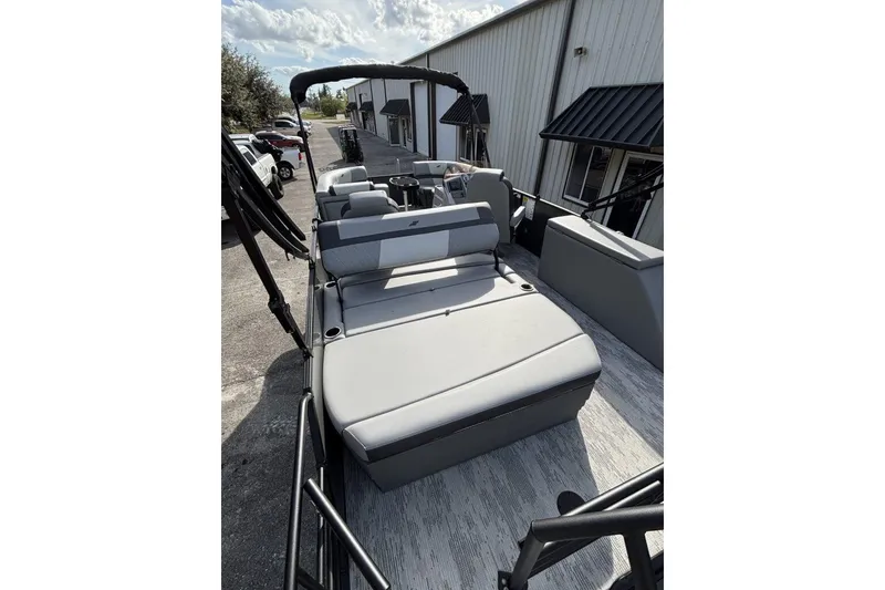 Slide: The Image of 2026 Starcraft EXS 1 Q DH boat with sleek seating and modern design. - 10