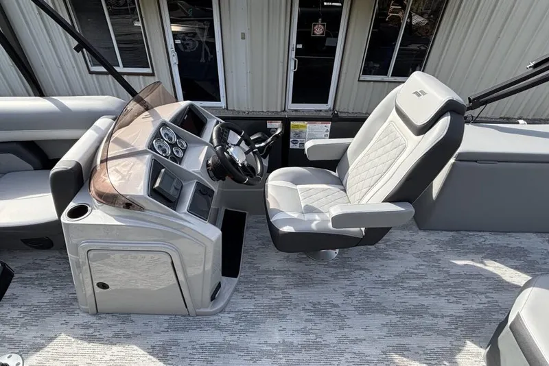 Slide: The Image of 2026 Starcraft EXS 1 Q DH boat interior with modern helm and captain's chair. - 14