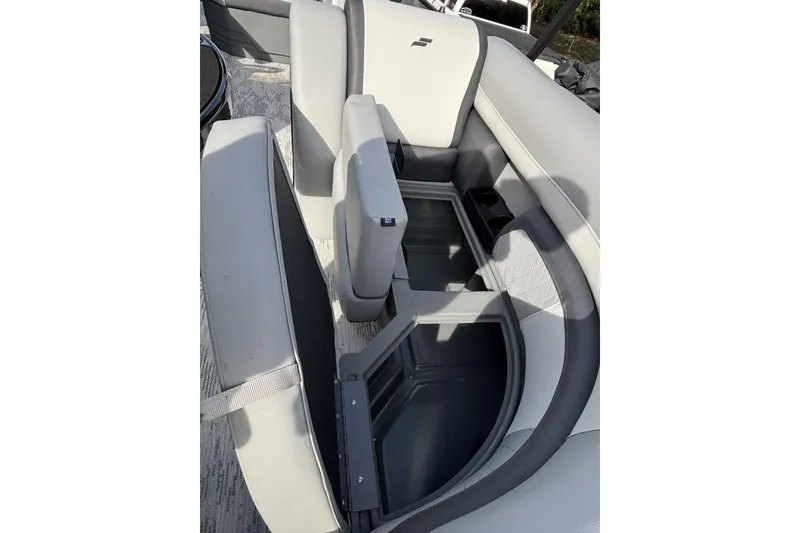 Slide: The Image of 2026 Starcraft EXS 1 Q DH boat interior with open storage compartment. - 17