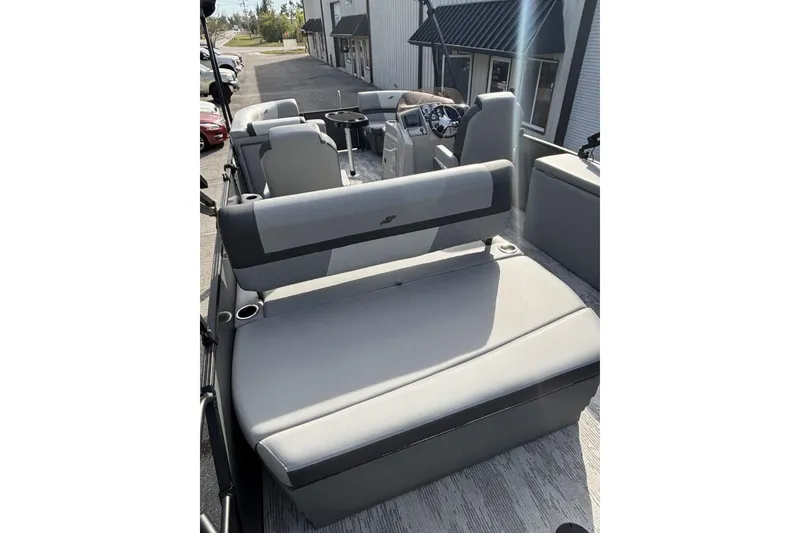 Slide: The Image of 2026 Starcraft EXS 1 Q DH boat interior with gray seating and modern design. - 21