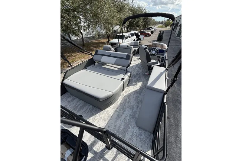 Slide: The Image of 2026 Starcraft EXS 1 Q DH pontoon boat with spacious seating and modern design. - 9