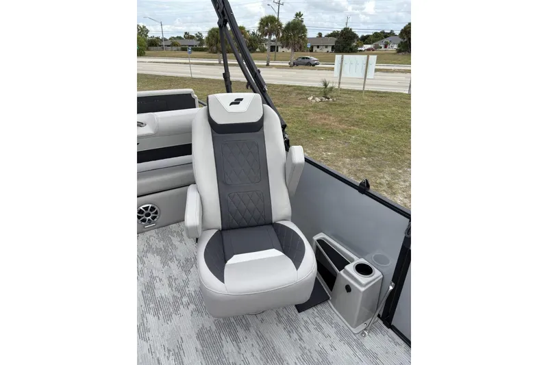 Slide: The Image of 2026 Starcraft SLS 3 Q DH pontoon boat interior with gray seating and table. - 10