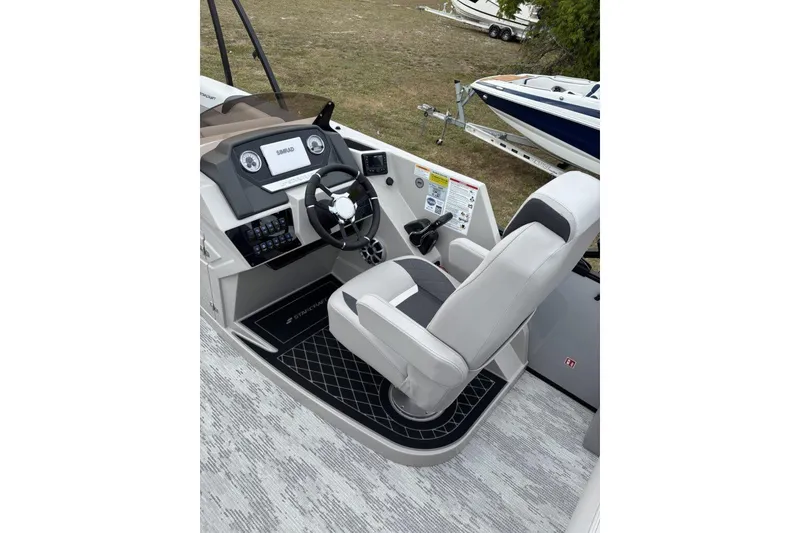 Slide: The Image of Starcraft SLS 3 Q DH 2026 boat interior with storage compartment open. - 11