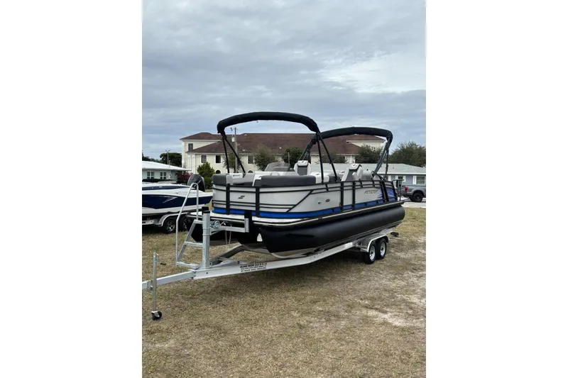 Slide: The Image of 2026 Starcraft SLS 3 Q DH boat interior with modern seating and table. - 7