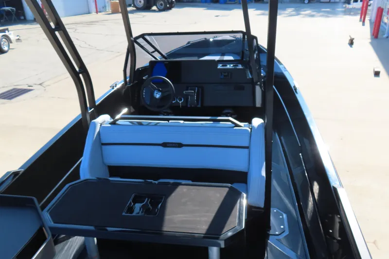 Slide: The Image of Interior of 2026 Iron 767 boat with modern steering and seating. - 10