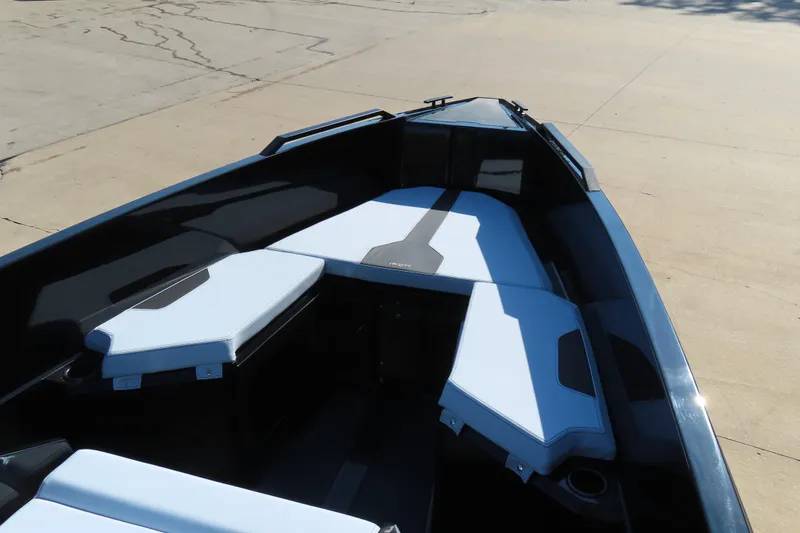 Slide: The Image of 2026 Iron 767 boat interior with sleek seating and modern design. - 12