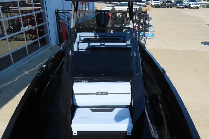 Slide: The Image of 2026 Iron 767 boat with sleek design, docked near a building. - 13