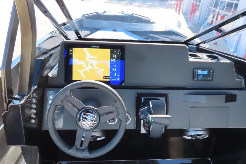 Slide: The Image of 2026 Iron 767 boat dashboard with steering wheel, navigation screen, and control panel. - 17
