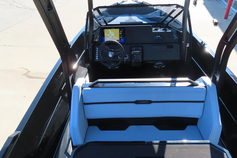 Slide: The Image of 2026 Iron 767 boat interior with modern dashboard and seating. - 19