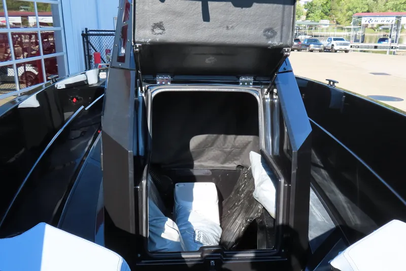 Slide: The Image of Open storage compartment in Iron 767 boat, 2026 model, with visible interior and cushions. - 22