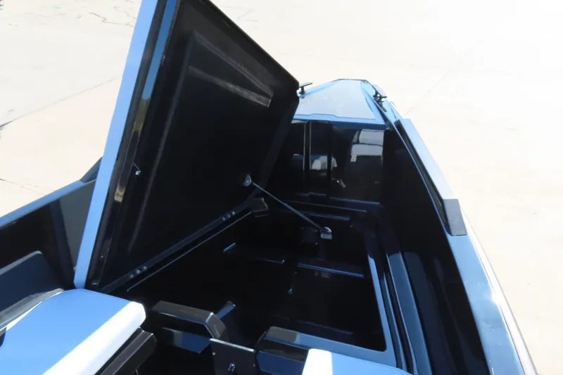 Slide: The Image of Open storage compartment of 2026 Iron 767 boat, showcasing interior space and design. - 24
