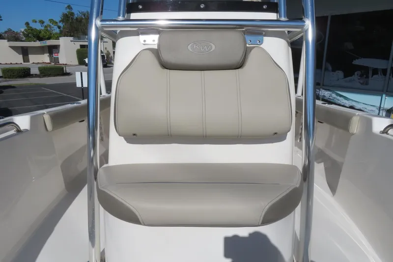 Slide: The Image of 2022 Key West 189 FS boat seat with stainless steel frame and beige upholstery. - 16