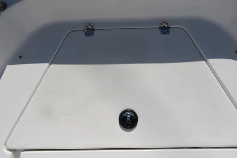 Slide: The Image of 2022 Key West 189 FS boat hatch with metal hinges and latch. - 18