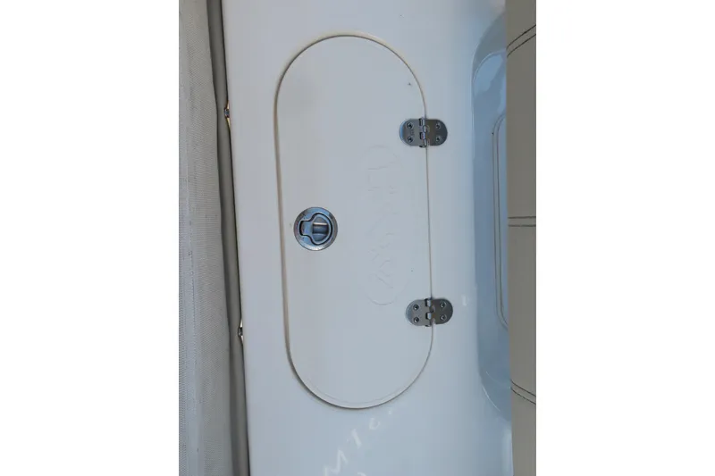 Slide: The Image of 2022 Key West 189 FS boat hatch with metal hinges and handle. - 24