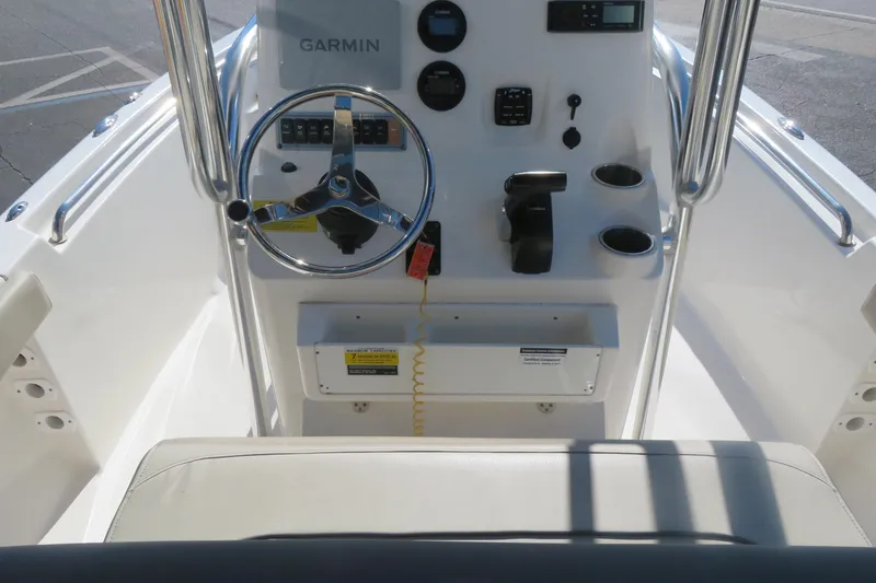 Slide: The Image of 2022 Key West 189 FS boat console with Garmin navigation and steering wheel. - 27