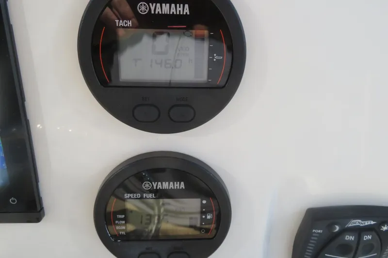 Slide: The Image of Yamaha gauges on 2022 Key West 189 FS boat dashboard, displaying tachometer and speed fuel data. - 29