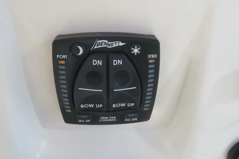 Slide: The Image of Bennett trim tab control on 2022 Key West 189 FS boat dashboard. - 31