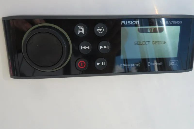 Slide: The Image of Fusion marine stereo system on a 2022 Key West 189 FS boat dashboard. - 32