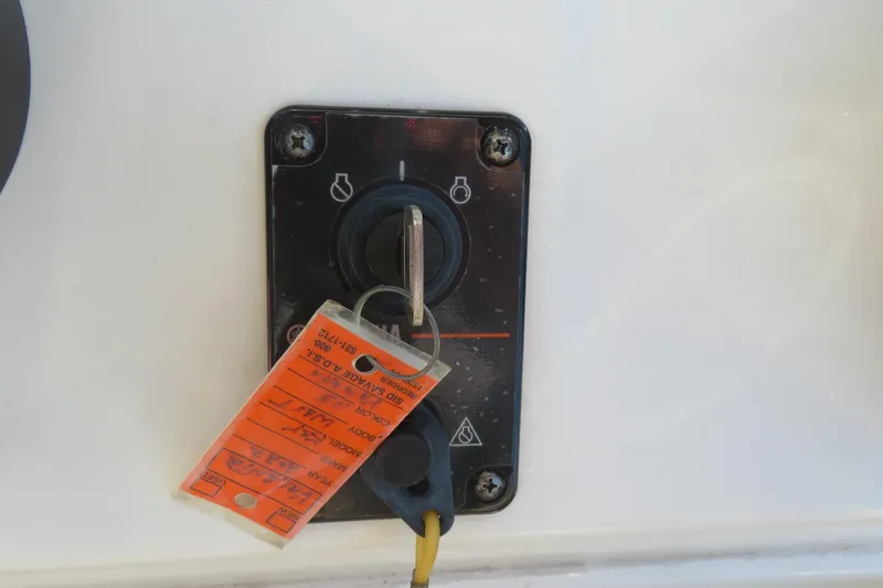 Slide: The Image of Key West 189 FS 2022 ignition switch with key and orange tag attached. - 33