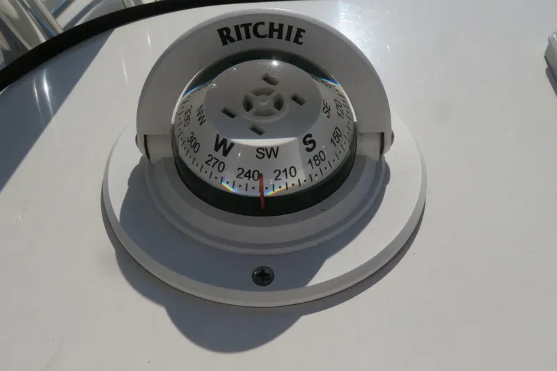 Slide: The Image of Compass on 2022 Key West 189 FS boat dashboard, showing directional headings. - 35