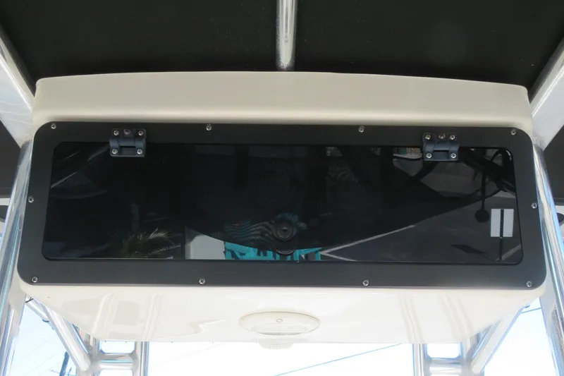 Slide: The Image of 2022 Key West 189 FS boat console with black panel and hinges. - 36