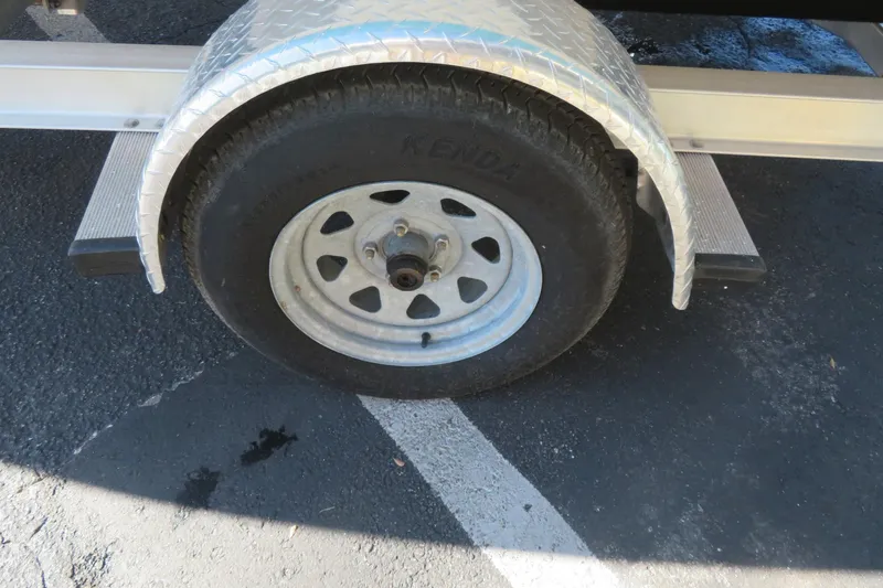 Slide: The Image of Trailer wheel of 2022 Key West 189 FS boat on asphalt. - 41