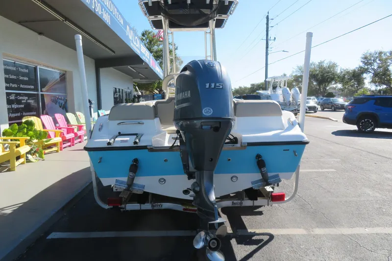 Slide: The Image of 2022 Key West 189 FS boat with Yamaha 115 engine, parked outside a marine store. - 5