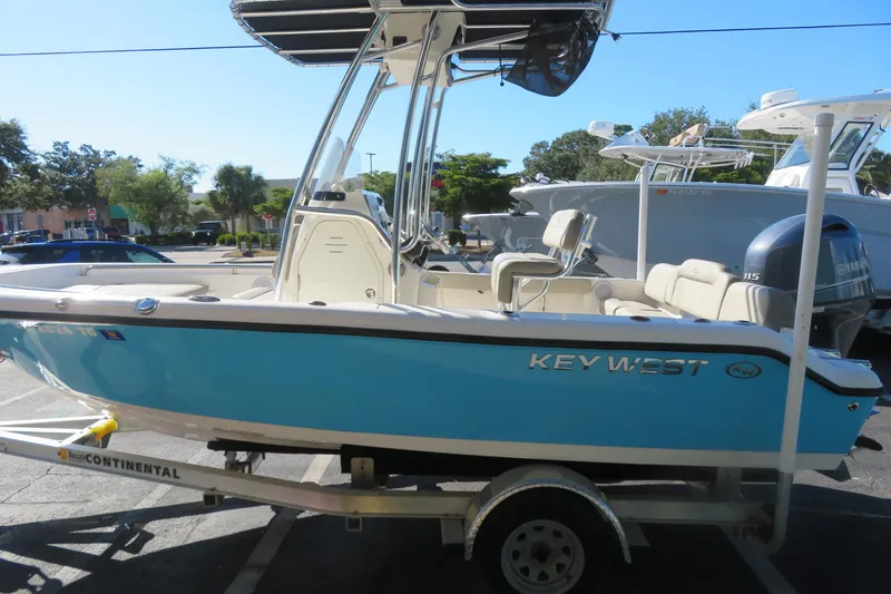 Slide: The Image of 2022 Key West 189 FS boat on trailer, blue hull, parked outdoors. - 7