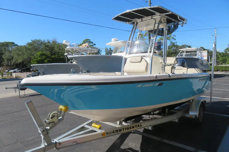 Slide: The Image of 2022 Key West 189 FS boat on trailer, parked outdoors, sunny day. - 8