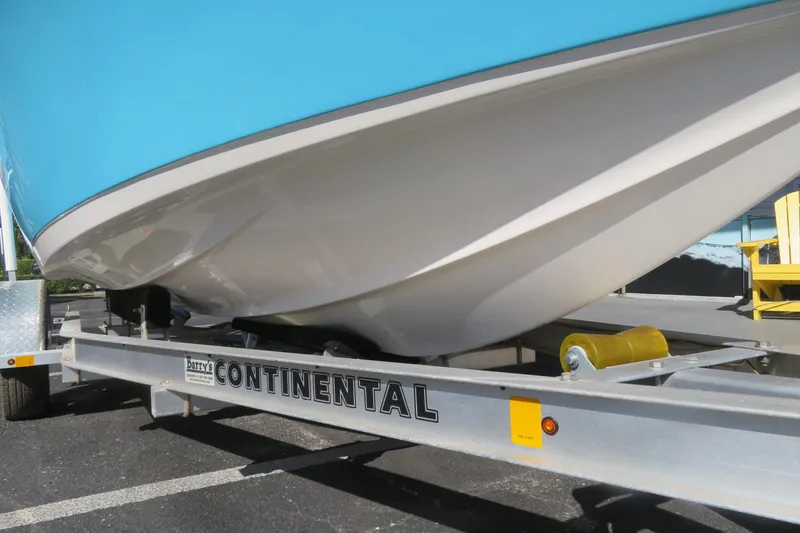 Slide: The Image of 2022 Key West 189 FS boat on Continental trailer, blue and white hull. - 9