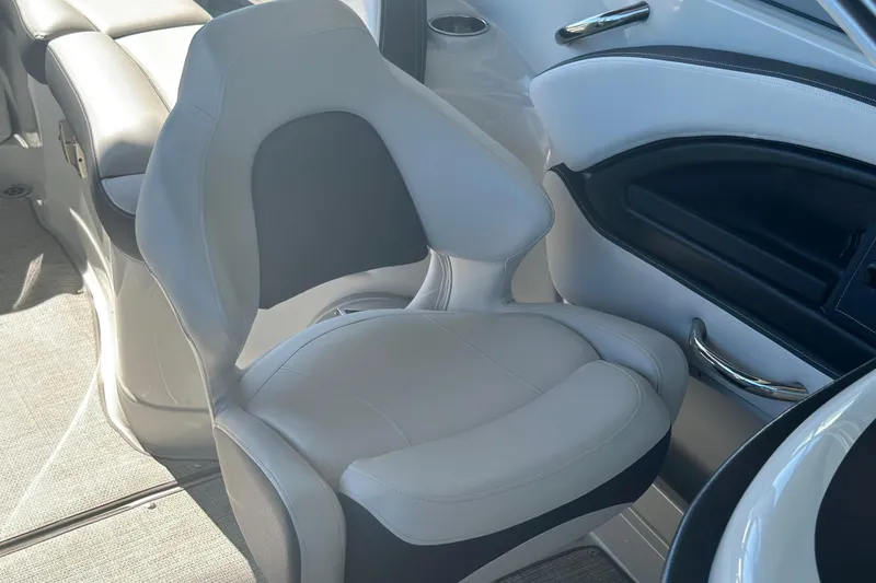 Slide: The Image of 2023 Crownline 290 CR boat interior with sleek, modern seating design. - 19