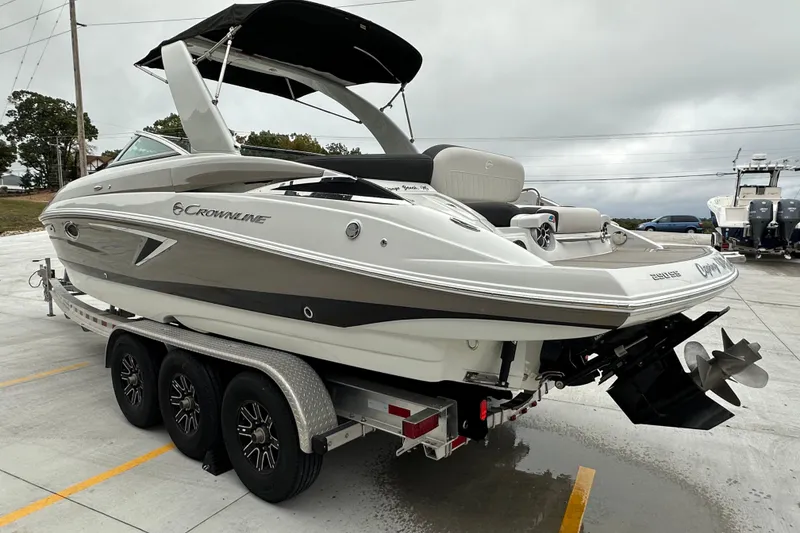 Slide: The Image of 2023 Crownline 290 CR boat on trailer, featuring sleek design and modern amenities. - 3