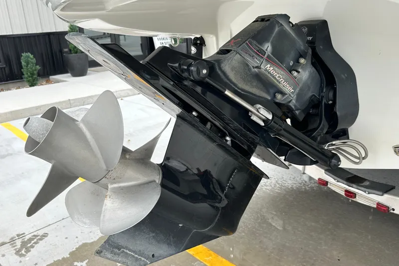Slide: The Image of 2023 Crownline 290 CR boat with MerCruiser engine and propeller detail. - 56