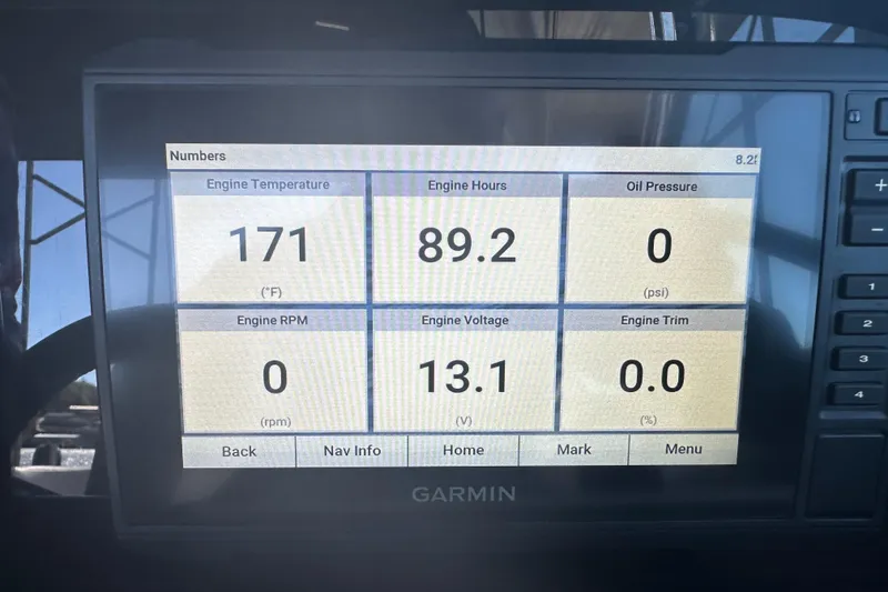 Slide: The Image of Garmin display showing engine stats for 2023 Crownline 290 CR: temperature, hours, voltage. - 58