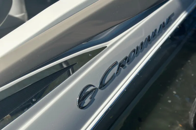 Slide: The Image of 2023 Crownline 290 CR boat, sleek design with logo detail. - 8