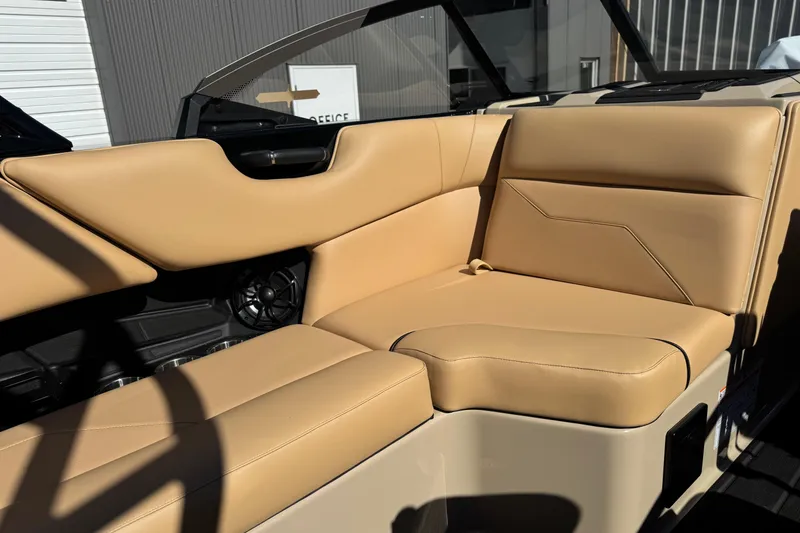Slide: The Image of 2025 Moomba Max boat interior with tan leather seating and modern design. - 7