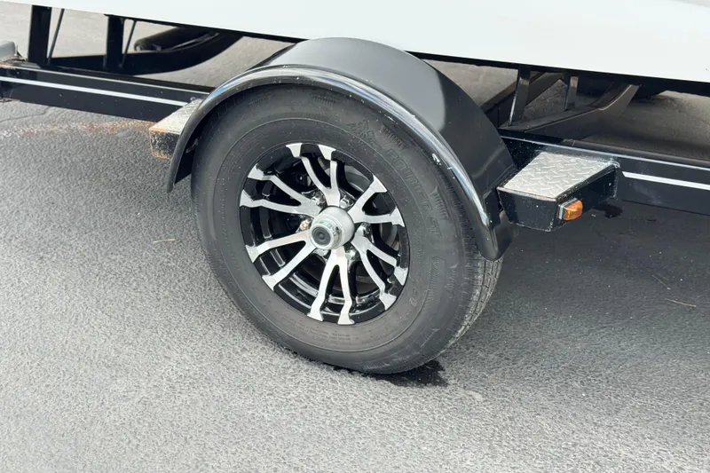 Slide: The Image of 2021 Glastron 205 trailer wheel with black and silver alloy rim. - 23