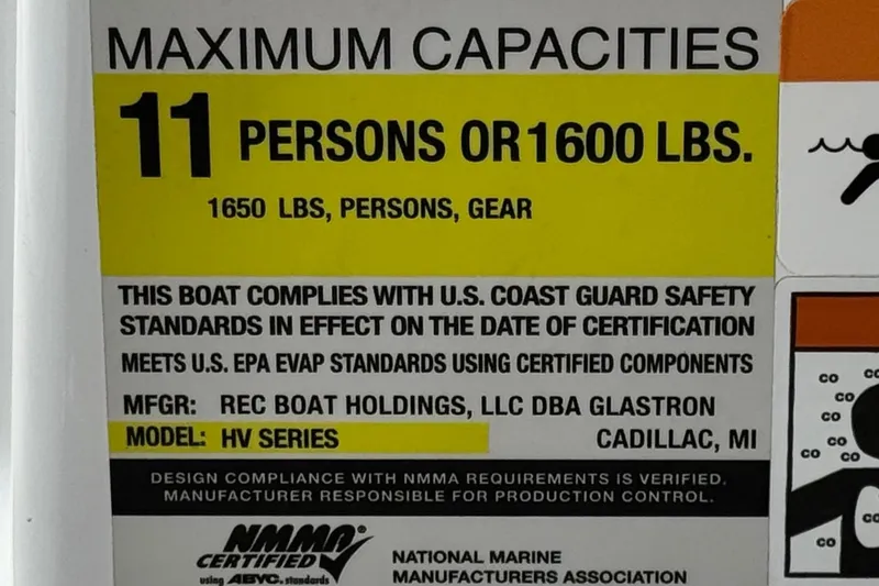 Slide: The Image of 2021 Glastron 205 boat capacity label: 11 persons or 1600 lbs, meets safety standards. - 25