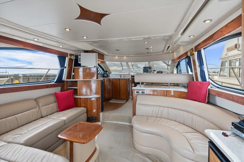 Slide: The Image of Luxurious interior of 2006 Meridian 411 Sedan yacht with elegant seating and wood accents. - 10