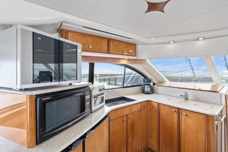 Slide: The Image of Luxurious kitchen interior of 2006 Meridian 411 Sedan yacht with modern appliances. - 12