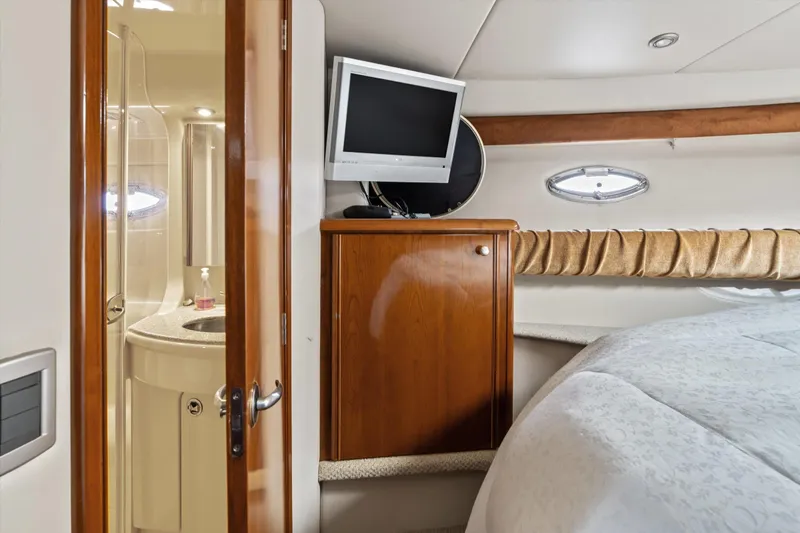 Slide: The Image of Interior of 2006 Meridian 411 Sedan yacht with TV, cabinet, and bathroom. - 18