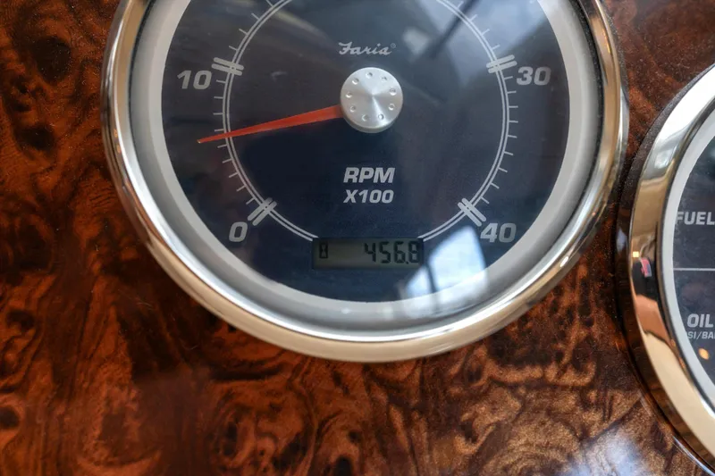 Slide: The Image of Close-up of 2006 Meridian 411 Sedan RPM gauge displaying 456.8 hours. - 26