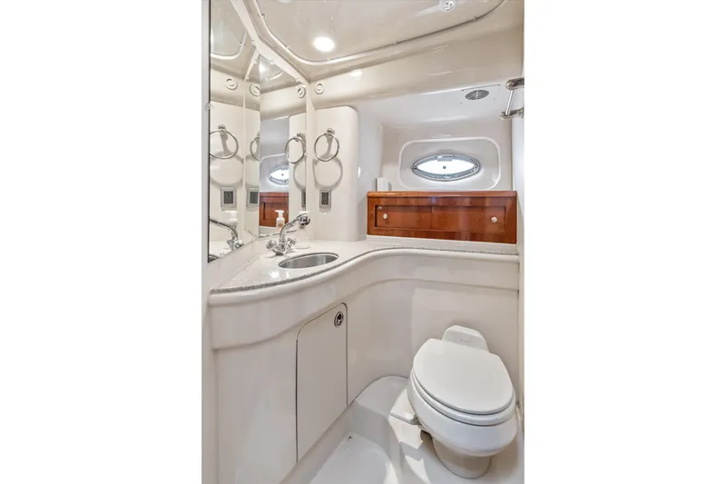 Slide: The Image of Luxurious bathroom in 2006 Meridian 411 Sedan yacht, featuring modern fixtures and elegant design. - 29